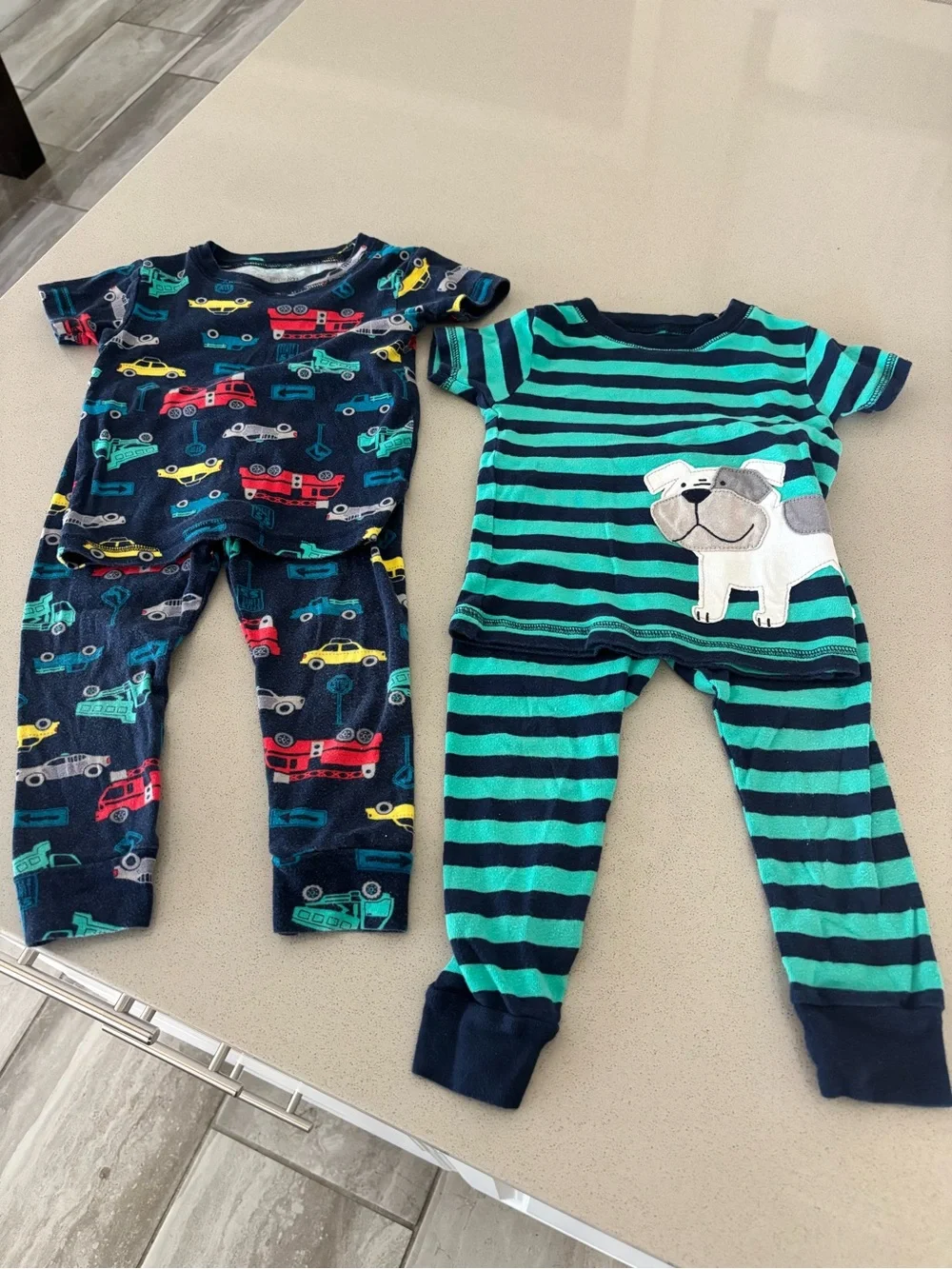 2 matching sets of Carter’s baby PJ’s